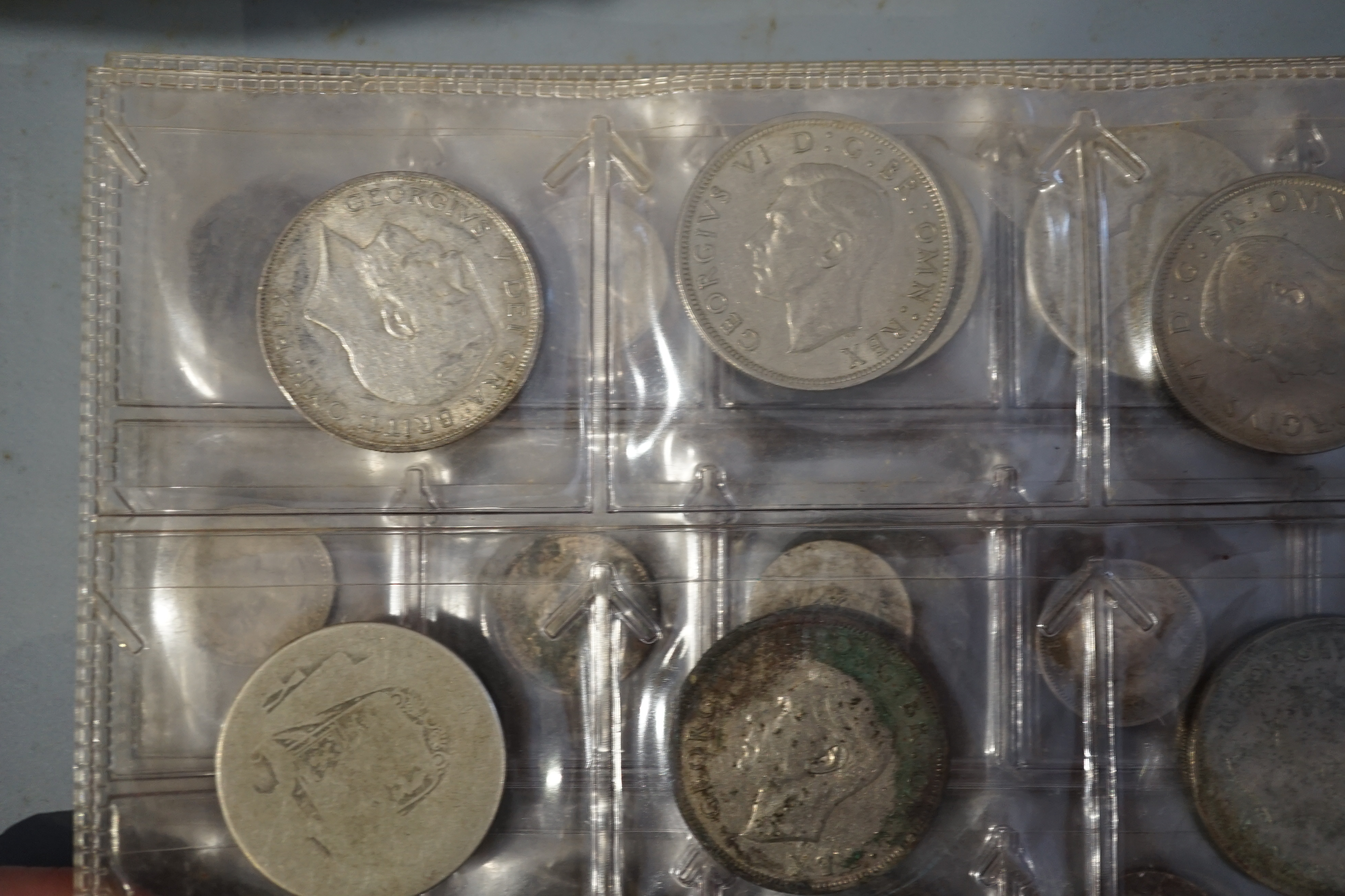 British and World coins, in an album and loose, together with banknotes, highlights include George V halfcrown 1923, about EF, and various pre-1947 silver coins
